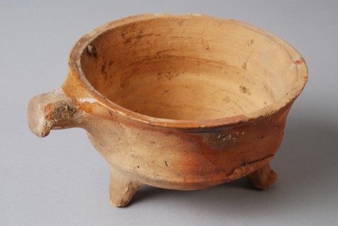Pottery stem bowl, fire test, red shard with some tears lead glaze, short handle, on three legs, fire test bowl