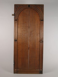 Room door with carving, door building part oak wood iron, hinges and locks) sawn planed cut laid out Panel door with four cleats
