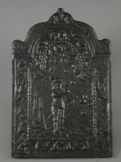 Fireback with bagpipe player, flower garlands, fish and shell, fire place cast iron, cast Rectangular fireplace plate with arch