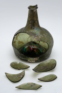 Green bellied bottle, irridescent, bottle holder bottomfound glass, free blown and shaped glass application Bulky bottle bell