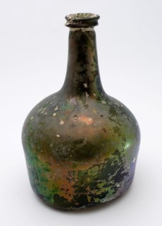 Bulbous bottle, 'hammer', bottle holder bottomfound glass, free blown and shaped glass application Bulky bottle in clear green