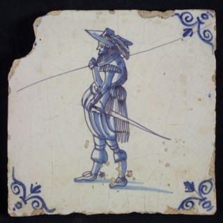 White tile with blue warrior; corner pattern ox head, wall tile tile sculpture ceramic earthenware glaze, baked 2x glazed