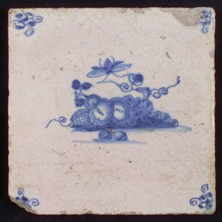 White tile with blue fruit and insect, corner motif spider, wall tile tile sculpture ceramic earthenware glaze, baked 2x glazed