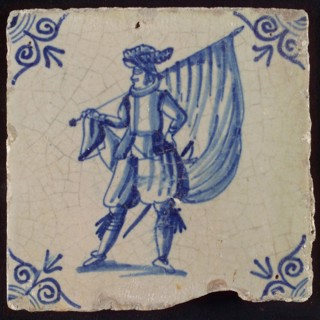Tile, blue on white ground, standard bearer, corner motif of ox's head, wall tile tile sculpture ceramic earthenware glaze