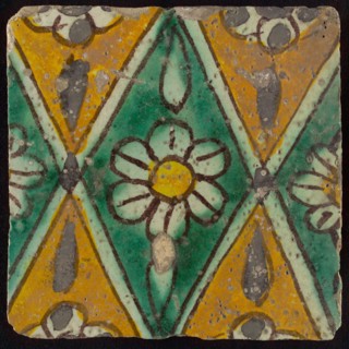 Floor tile, brown draft, green and yellow on white ground, central green oblique glass in which white flower with yellow heart