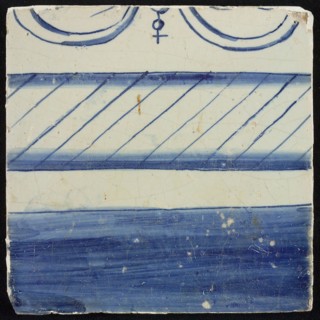 Tile, blue on white, border with filled part and part with hatching, top edge visible part of bow and ball with cross, tile