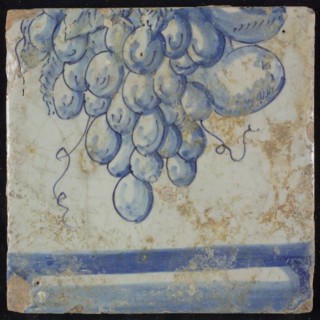 Tile of chimney pilaster, blue on white, part of upwards continuous representation with fruits, including grapes, underneath