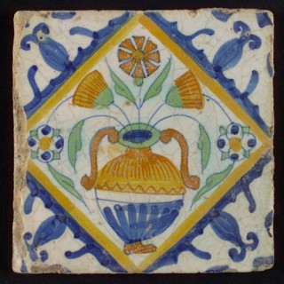 Tile, orange, brown, green and blue on white, flowerpot in square, corner pattern palmet, wall tile tile sculpture ceramic