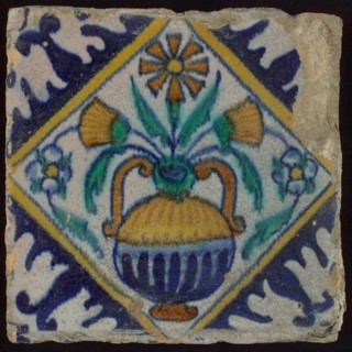 Tile, orange, brown, green, and blue on white, flowerpot in square, corner pattern palmet, wall tile tile sculpture ceramic