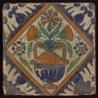 Tile, orange, brown, green, and blue on white, flowerpot in square, corner pattern palmet, wall tile tile sculpture ceramic