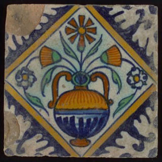 Tile, orange, brown, green, and blue on white, flowerpot in square, corner pattern palmet, wall tile tile sculpture ceramic