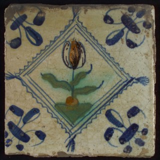 Tile, tulip on ground in orange, purple and blue on white, inside serrated squared with tuft, corner pattern french lily, wall