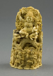 Jambhala, the God of Wealth, Seated on a Dragon, 15th century, Eastern Tibet, Tibet, Ivory with