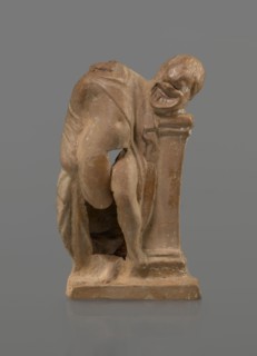 Terracotta figurine of a youth with a terracotta mask; creator, ca. 332–30 BC, Hellenistic period