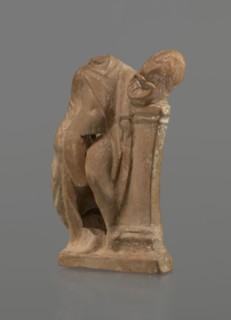 Terracotta figurine of a youth with a terracotta mask, ca. 332–30 BC; Hellenistic period 4th