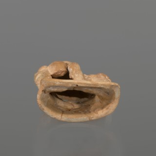 Terracotta figurine of a youth with a terracotta mask, attributed to Hoffmann, Henri ca. 1823–1897