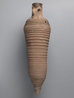 Amphora, unknown Egyptian workshop; wine transport vessel with a strongly elongated belly, narrowed