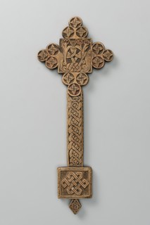Hand cross, Ethiopian workshop. The arms of the cross are each formed by three stacked discs