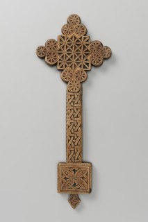 Hand cross, Ethiopian workshop. The arms of the cross are each formed by three stacked discs