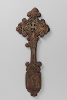 Hand cross, Ethiopian workshop. The arms of the cross are rhombus-shaped, the tops decorated with