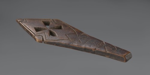 Hand cross - fragment. Simple engraved decoration on the surface; four triangular cutouts arranged