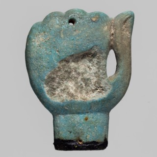 Amulet - left fist element of a mummy net, mummification equipment amulet in the form of a left
