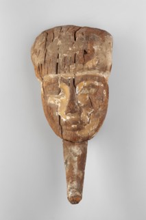 Sarcophagus mask. Sarcophagus mask with a preserved face, the middle part of a wig, and a false
