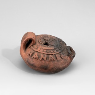 Lamp with the Greek inscription C???? ??? ????? May he be my saviour; crosses at the beginning and