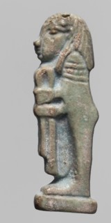 Amulet — Imset. Figurine of Imset one of the Four Sons of Horus, worked in relief; shown in left