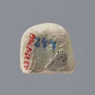 Fragment of a shabti, Head of a shabti figurine with indistinct facial features, in a smooth wig.
