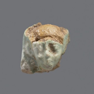Fragment of a shabti, head of a shabti figurine with carefully rendered facial features in a smooth