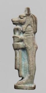 Amulet - Duamutef. Relief figurine of Duamutef, one of the Sons of Horus. A mummy-like figure with