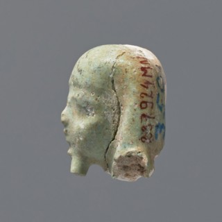 Fragment of a shabti. Head of a shabti figurine with rather carelessly rendered facial features, in