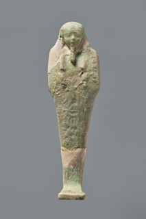 Ushabti, Mummy-shaped figurine, standing on a base with the back resting on a pillar. Arms crossed