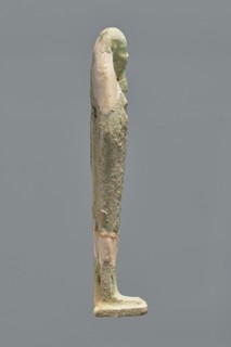 Ushabti, Mummy-shaped figurine, standing on a base with the back resting on a pillar. Arms crossed