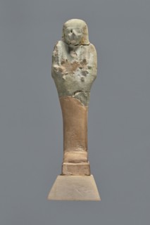 Fragment of a shabti, Mummy-shaped funerary figurine shabti, grave good, upper part preserved to
