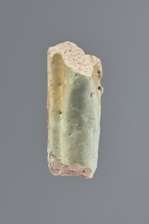 Fragment of a shabti, Middle part of the torso of a shabti figurine, preserved from the elbows to