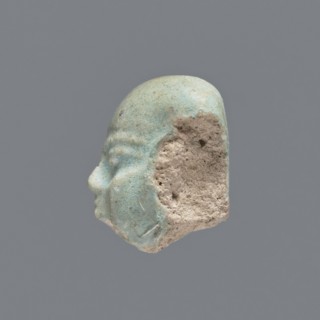 Fragment of a shabti;, Head of a shabti figurine with carefully rendered facial features. Celadon