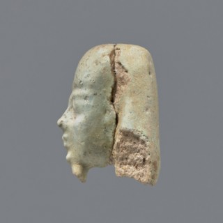 Fragment of a shabti. Head of a shabti figurine with carefully rendered facial features; smooth