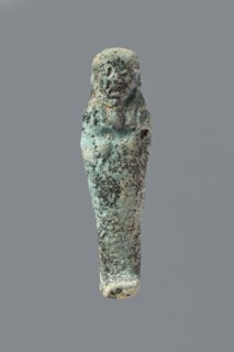 Ushabti, Mummy-shaped figurine, flat back. Arms crossed on the chest with only the hands protruding