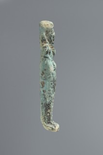 Ushabti, mummy-shaped figurine. Flat back. Arms crossed on the chest, only the hands protruding