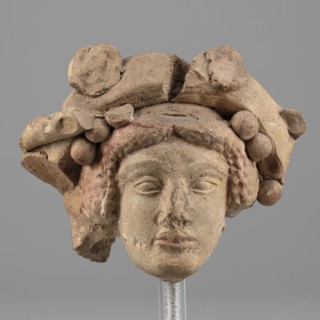 Head of Dionysus, unknown author. A small terracotta head of Dionysus, part of a larger lost