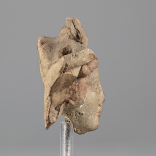 Head of Dionysus, A small terracotta head of Dionysus, part of a larger lost sculpture. The figure