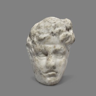 Head of a young man, unknown Greek workshop. A small head of a young man, probably a fragment of a
