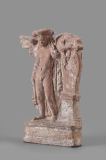 Figurine of Eros with a lyre, Eros myth, Greek deity, lyre musical instrument. Figurine of Eros