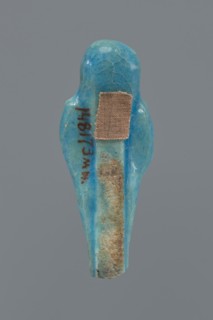 Shabti, mummy-shaped figurine, funerary gift. Mummy-shaped figurine with back supported by a