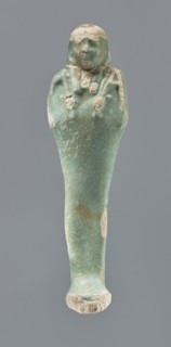 Shabti, Mummy-shaped figurine, funerary gift, 664–332 BC Late Period, Egypt. Standing on a base,