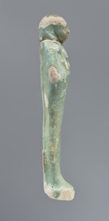 Shabti, mummy-shaped figurine, funerary gift, hoes; standing on a base, back supported by a