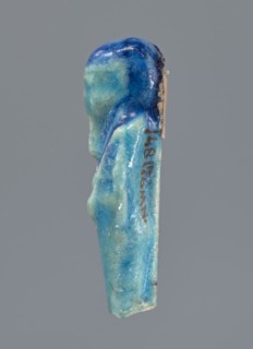 Shabti, mummy-shaped figurine, funerary offering. Mummy-shaped figurine supported at the back on a