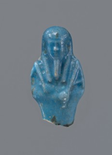 Shabti, Mummy-shaped figurine, funerary offering, supported on a pillar at the back. Legs missing.
